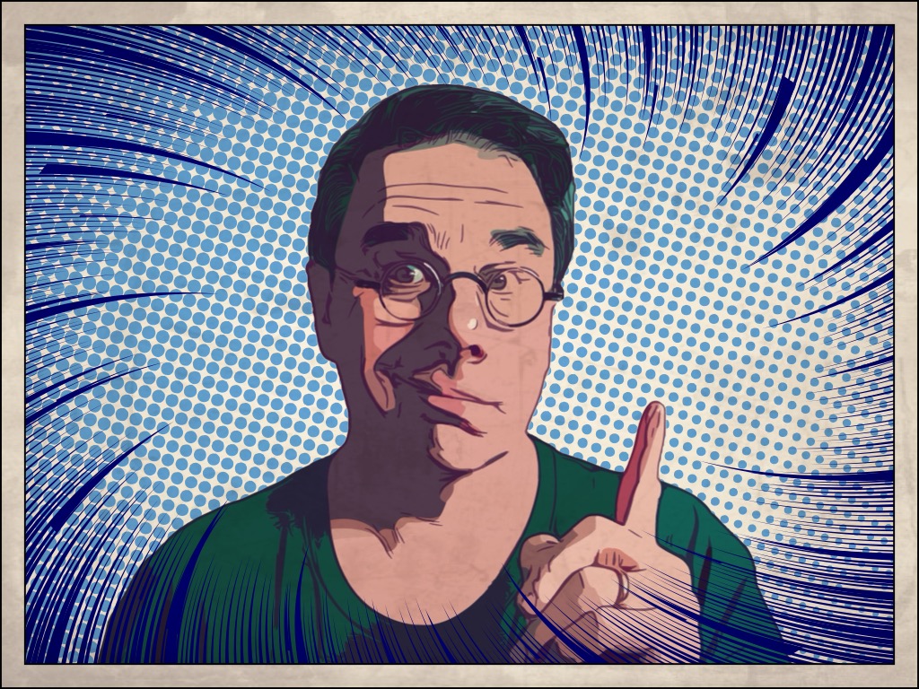 Wes, looking toward the camera, with him raising is pointer finger up as if to make a point.