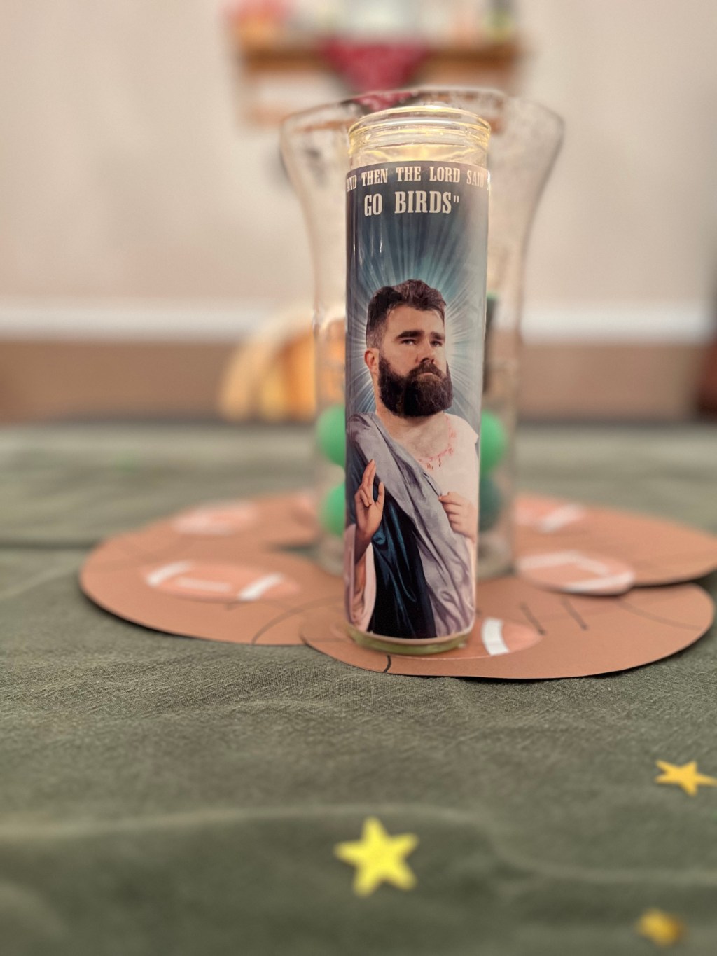 Jason Kelce candle with the saying, “And the LORD said, ‘Go Birds.’”